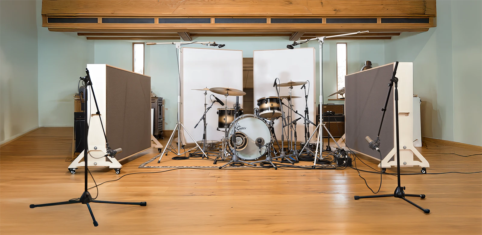 A drumset in a recording with elaborate miking and baffling.